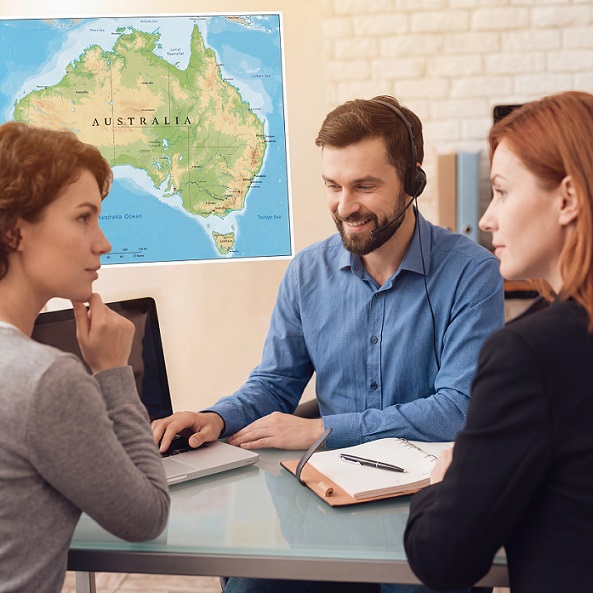 Tour leader discussing group accommodation plans with Just Group Accommodation consultant