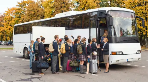 Students getting aboard a bus